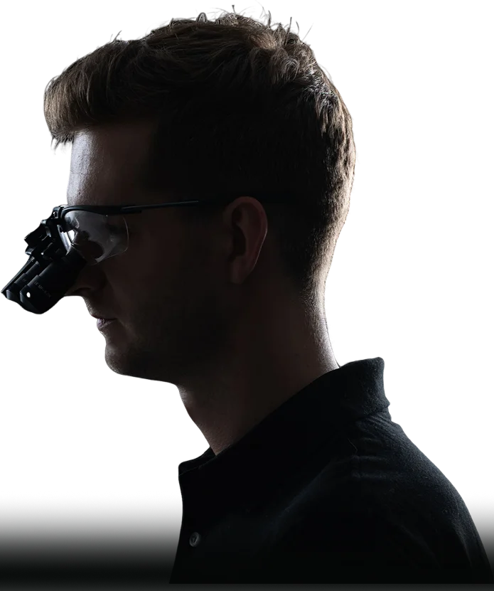 Home 7 Vladyslav Pereverzyev side photo with dental loupes